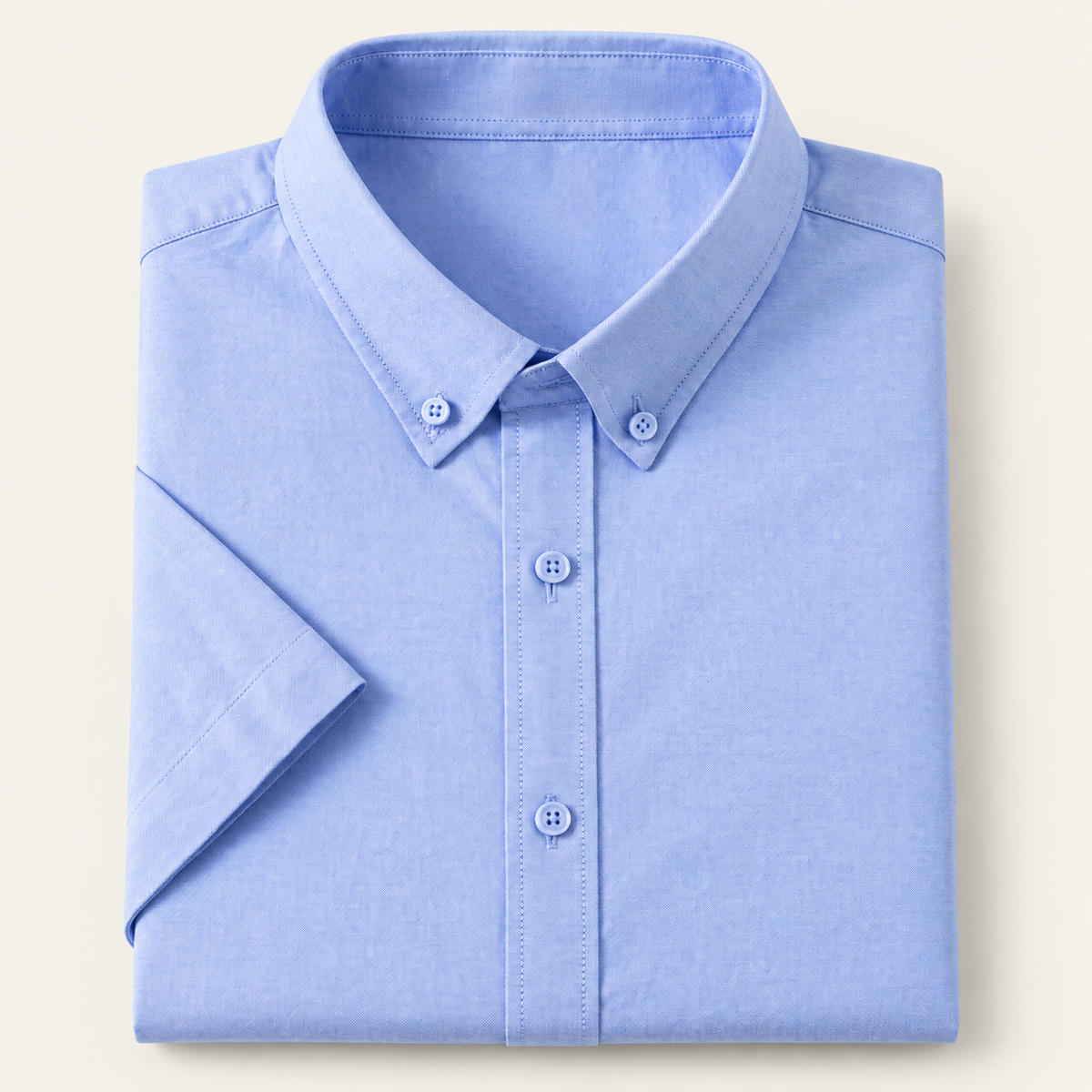Cotton oxford short sleeve shirt in light blue, folded, front view