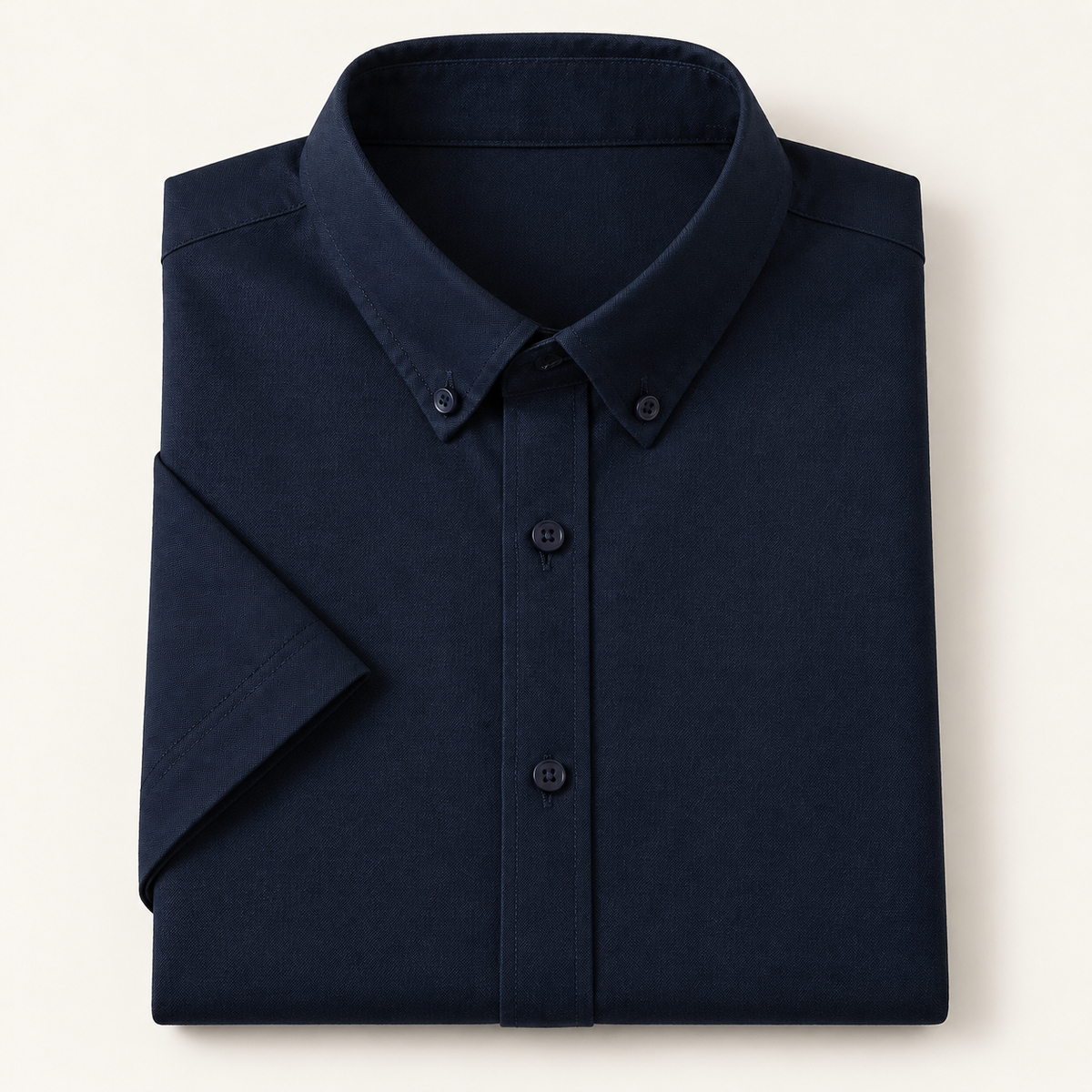 Cotton oxford short sleeve shirt in navy, folded, front view